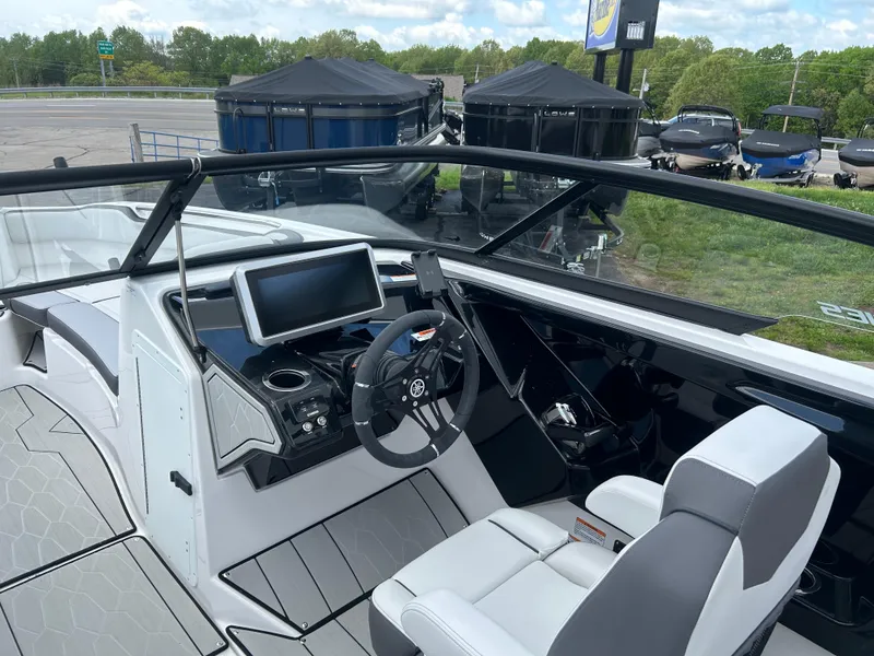 Slide: The Image of 2025 Yamaha Boats 252XE cockpit with modern dashboard and steering wheel. - 7
