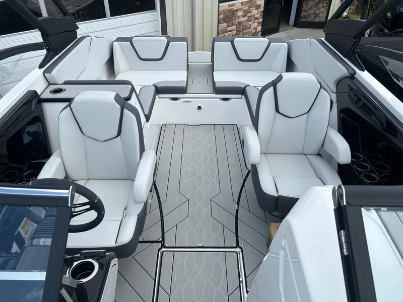 Slide: The Image of 2025 Yamaha Boats 252XE interior with modern seating and sleek design. - 8