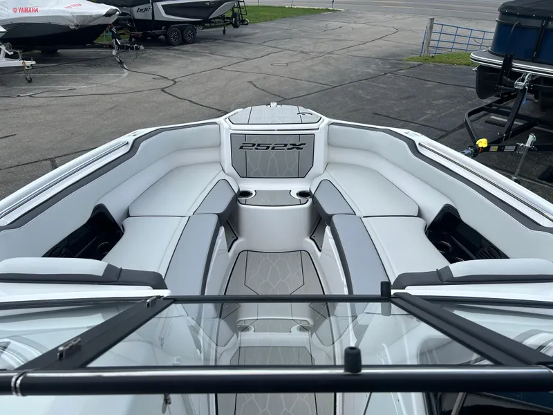 Slide: The Image of 2025 Yamaha Boats 252XE interior with sleek, modern seating and spacious layout. - 9
