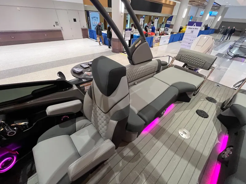 Slide: The Image of Luxurious 2025 Avalon Excalibur LTD Quad Lounge boat interior with modern seating and ambient lighting. - 26