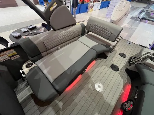 Slide: The Image of 2025 Avalon Excalibur LTD Quad Lounge interior with gray seating and red accent lighting. - 28