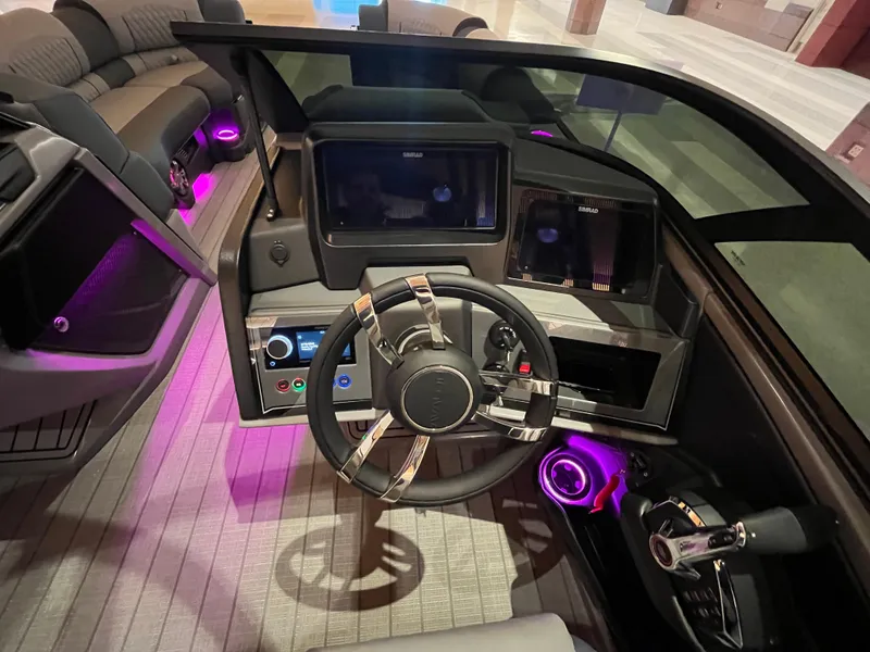 Slide: The Image of Luxurious 2025 Avalon Excalibur LTD boat interior with modern dashboard and ambient lighting. - 42