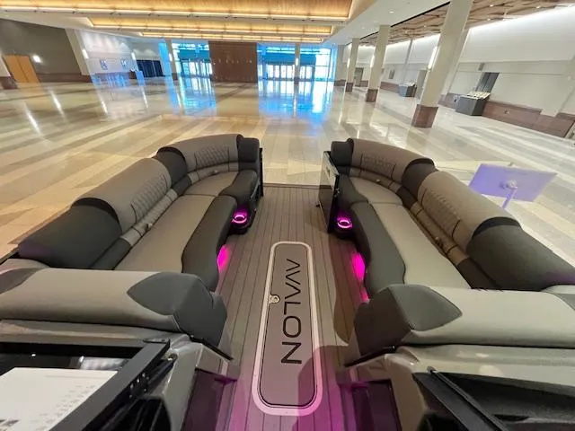 Slide: The Image of Luxurious Avalon Excalibur LTD Quad Lounge with ambient lighting, 2025 model, in a spacious showroom. - 43