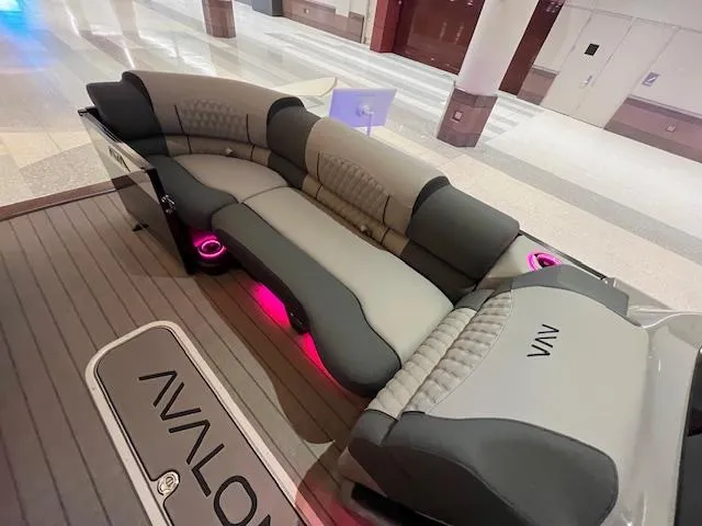 Slide: The Image of Luxurious Avalon Excalibur LTD Quad Lounge with ambient lighting, 2025 model, in a showroom setting. - 45