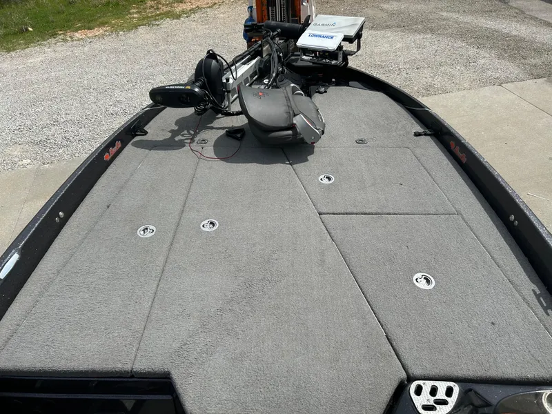 Slide: The Image of 2020 Bass Cat Lynx boat deck with trolling motor and storage compartments. - 11