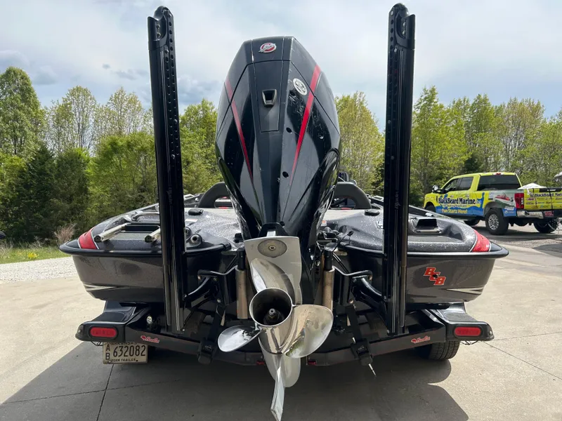 Slide: The Image of 2020 Bass Cat Lynx boat rear view with powerful engine and dual power poles. - 3