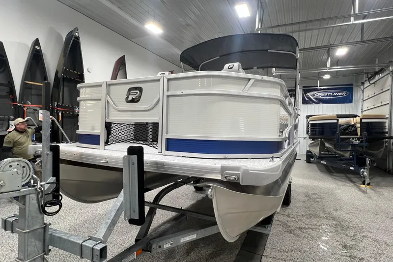 Slide: The Image of 2025 Princecraft Sportfisher 21-2S pontoon boat in a showroom setting. - 14
