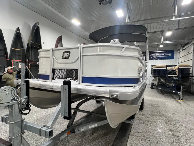 Slide: The Image of 2025 Princecraft Sportfisher 21-2S pontoon boat in showroom, front view. - 3