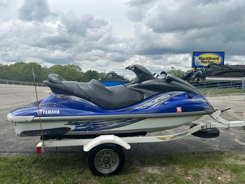 Slide: The Image of 2005 Yamaha WaveRunner FX Cruiser on trailer, parked outdoors near BlackBeard Marine sign. - 0