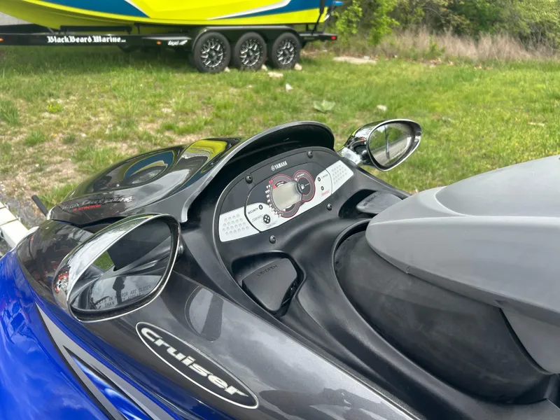 Slide: The Image of 2005 Yamaha WaveRunner FX Cruiser dashboard with mirrors, parked on grass. - 5