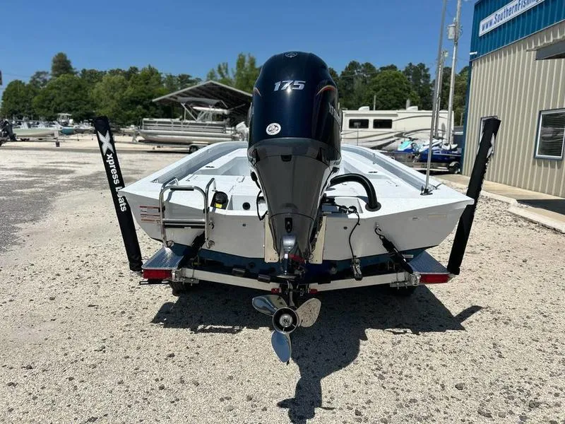 Slide: The Image of 2025 Xpress H22B boat with 175 horsepower engine, parked outdoors. - 5