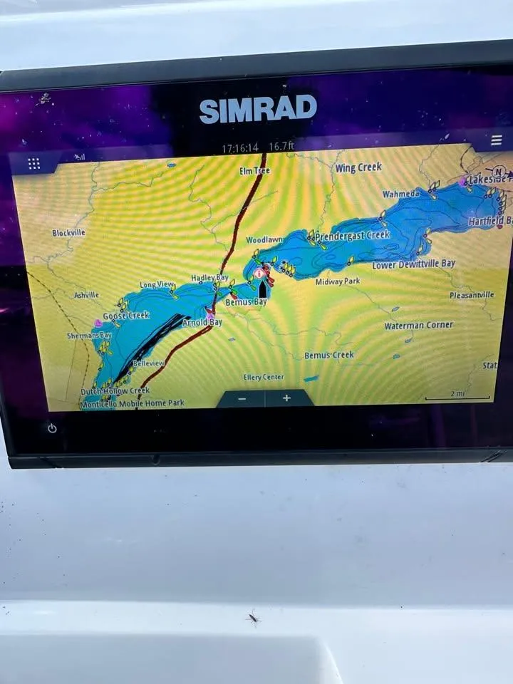 Slide: The Image of Simrad navigation display on 2020 Yamaha Boats Robalo, showing detailed waterway map. - 12