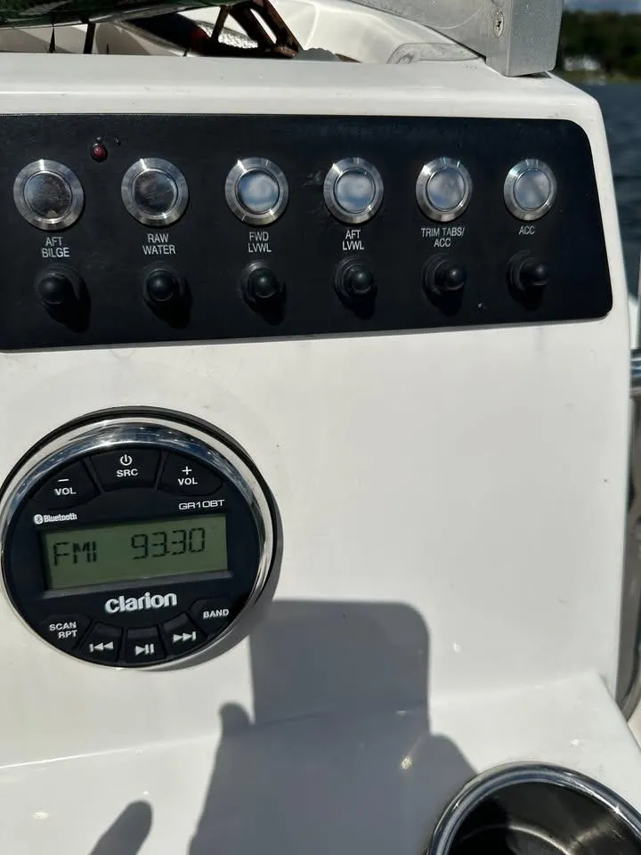 Slide: The Image of Control panel of a 2020 Yamaha Boats Robalo with Clarion radio display. - 15