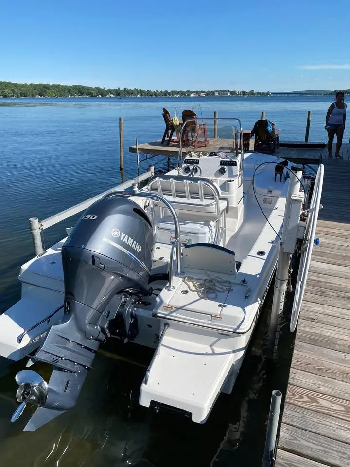 Slide: The Image of 2020 Yamaha Boats Robalo docked on a serene lake with clear blue skies. - 3