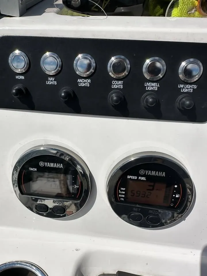 Slide: The Image of Control panel of a 2020 Yamaha Boats Robalo with gauges and switches. - 8