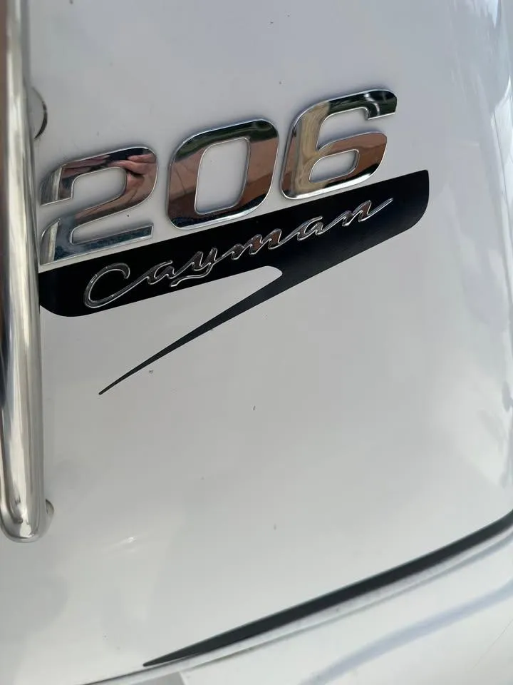 Slide: The Image of Close-up of 2020 Yamaha Boats Robalo 206 Cayman logo on white surface. - 9