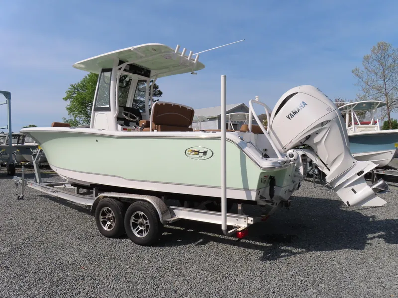 Slide: The Image of 2024 Sea Hunt Ultra 239 SE boat on trailer with Yamaha outboard motor. - 1