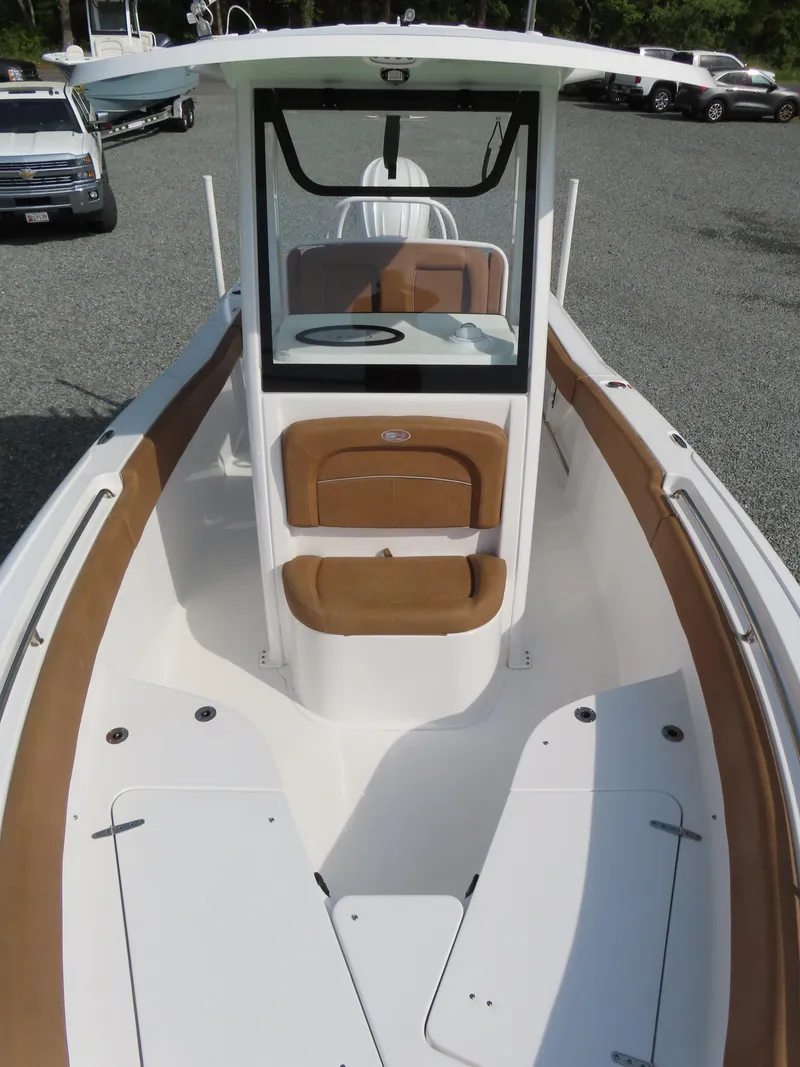Slide: The Image of 2024 Sea Hunt Ultra 239 SE boat with sleek design and spacious seating. - 14