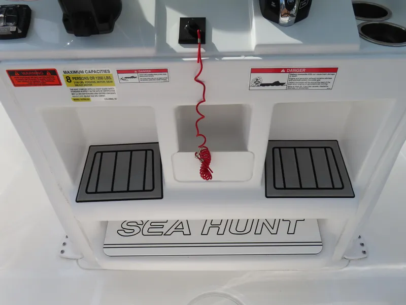 Slide: The Image of 2024 Sea Hunt Ultra 239 SE boat console with safety features and branding. - 26