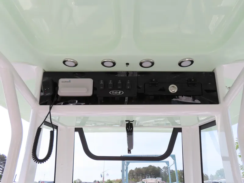 Slide: The Image of 2024 Sea Hunt Ultra 239 SE boat console with electronics and controls. - 27