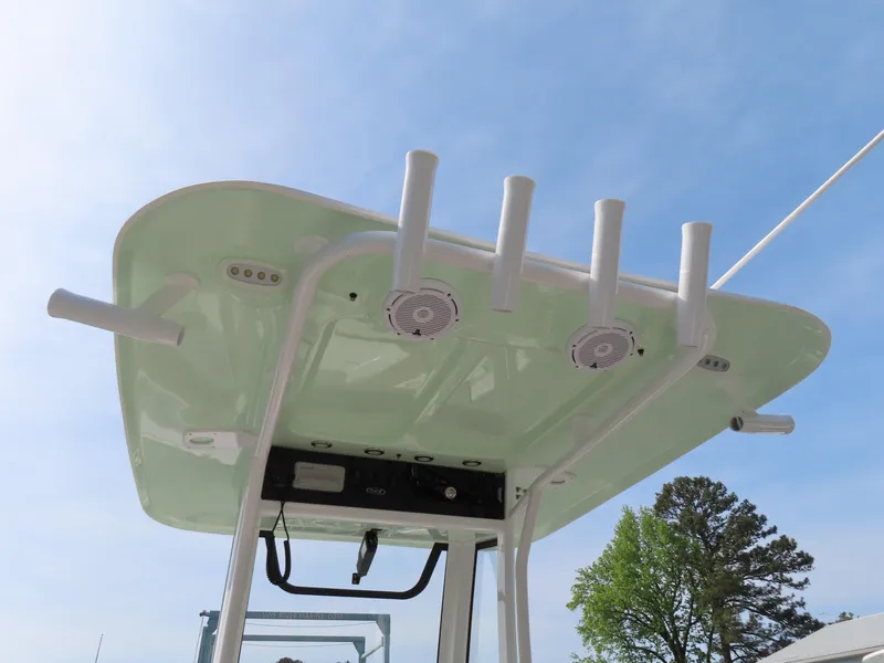 Slide: The Image of 2024 Sea Hunt Ultra 239 SE boat top with rod holders and speakers. - 28