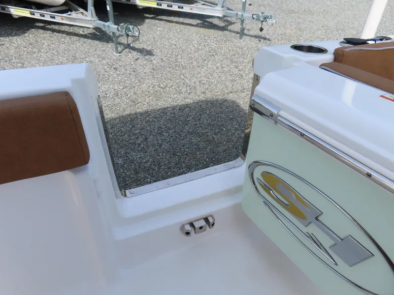 Slide: The Image of 2024 Sea Hunt Ultra 239 SE boat interior with seating and storage compartment. - 33