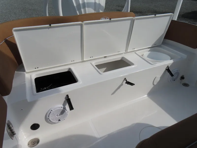 Slide: The Image of 2024 Sea Hunt Ultra 239 SE boat storage compartments and seating area. - 36