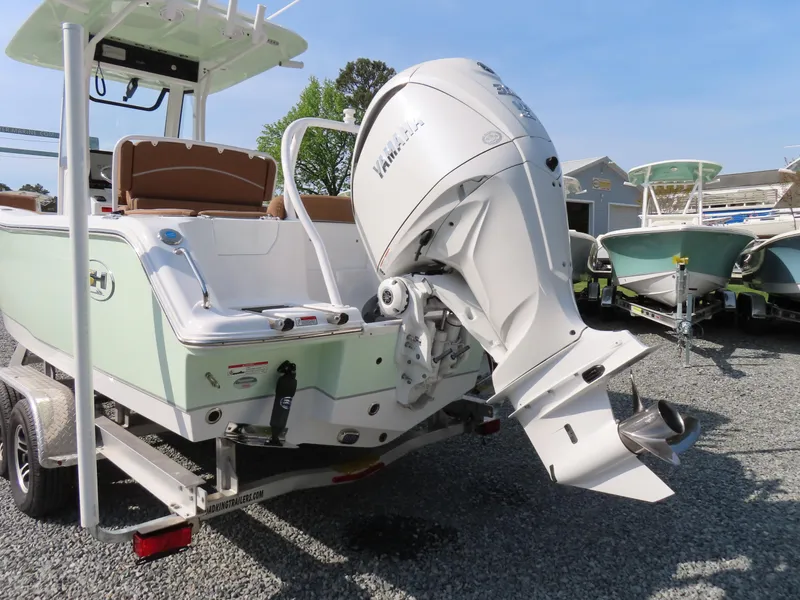 Slide: The Image of 2024 Sea Hunt Ultra 239 SE boat with Yamaha outboard motor on trailer. - 4