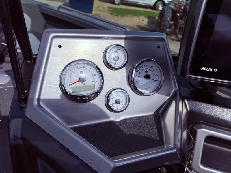 Slide: The Image of Dashboard of 2023 Lund 2275 Baron boat with gauges and controls. - 17