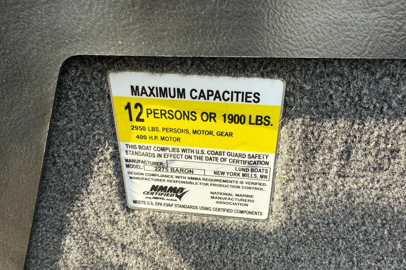 Slide: The Image of 2023 Lund 2275 Baron capacity label: 12 persons or 1900 lbs, 400 HP motor. - 31