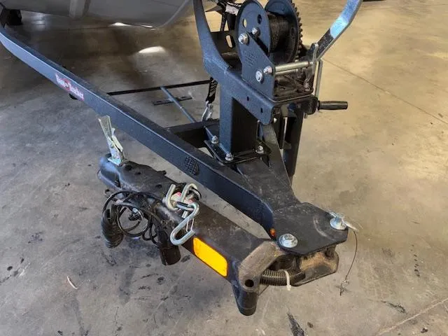 Slide: The Image of Trailer hitch of a 2023 Bass Tracker Classic XL boat on concrete floor. - 19