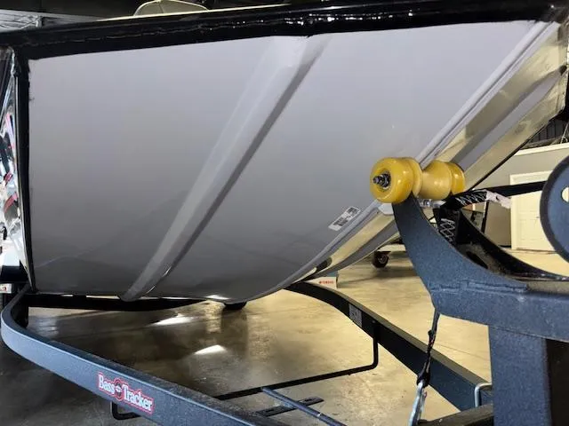 Slide: The Image of 2023 Bass Tracker Classic XL boat on trailer, close-up of hull and roller. - 20