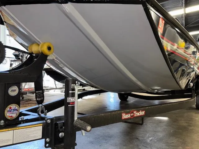Slide: The Image of 2023 Bass Tracker Classic XL boat on trailer in garage setting. - 21