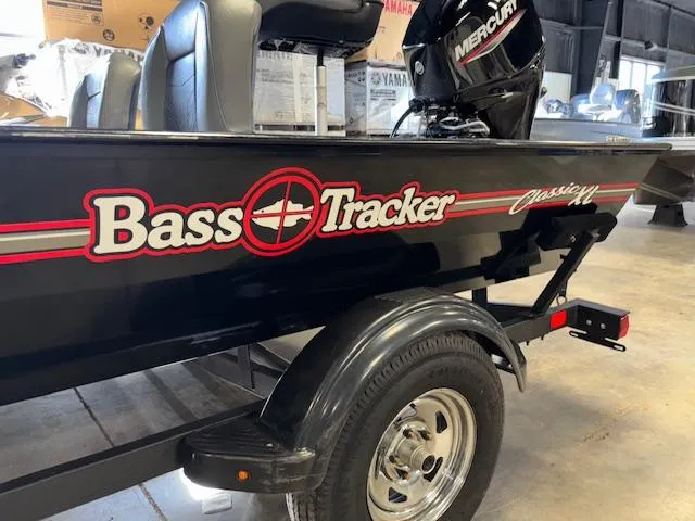 Slide: The Image of 2023 Bass Tracker Classic XL boat with Mercury engine in a showroom. - 3