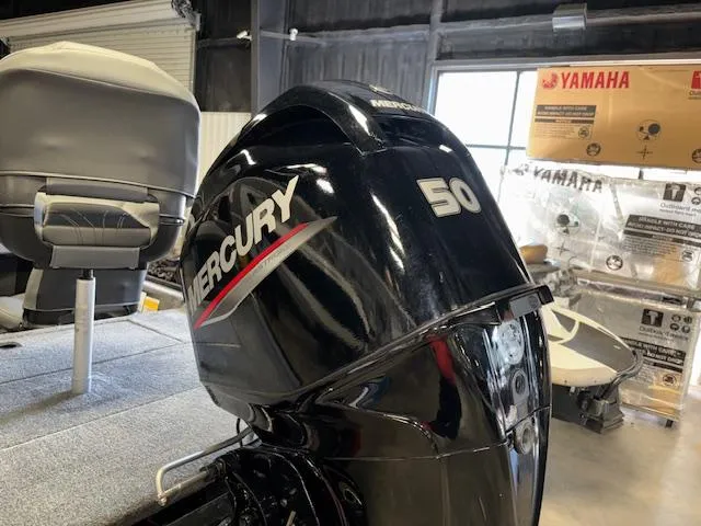 Slide: The Image of 2023 Bass Tracker Classic XL with Mercury 50 engine in a showroom. - 5