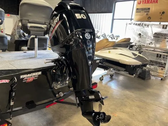 Slide: The Image of 2023 Bass Tracker Classic XL with Mercury 50 outboard motor in showroom. - 6