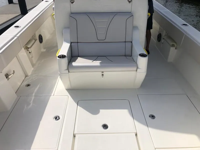 Slide: The Image of 2020 SeaVee 370z boat interior with white seating and spacious deck layout. - 11