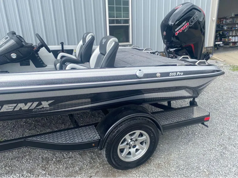 Slide: The Image of 2025 Phoenix 518 Pro boat with Mercury Pro XS engine on a trailer. - 16