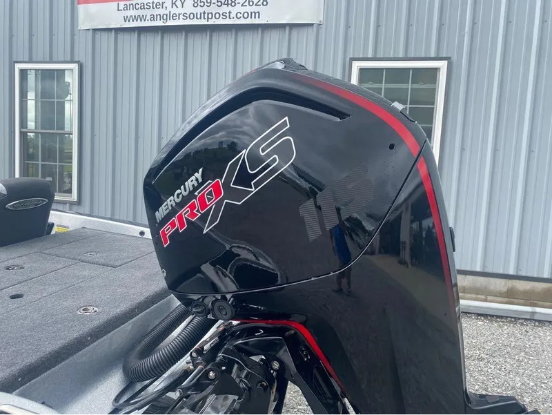 Slide: The Image of 2025 Phoenix 518 Pro boat with Mercury Pro XS engine, displayed outdoors. - 6