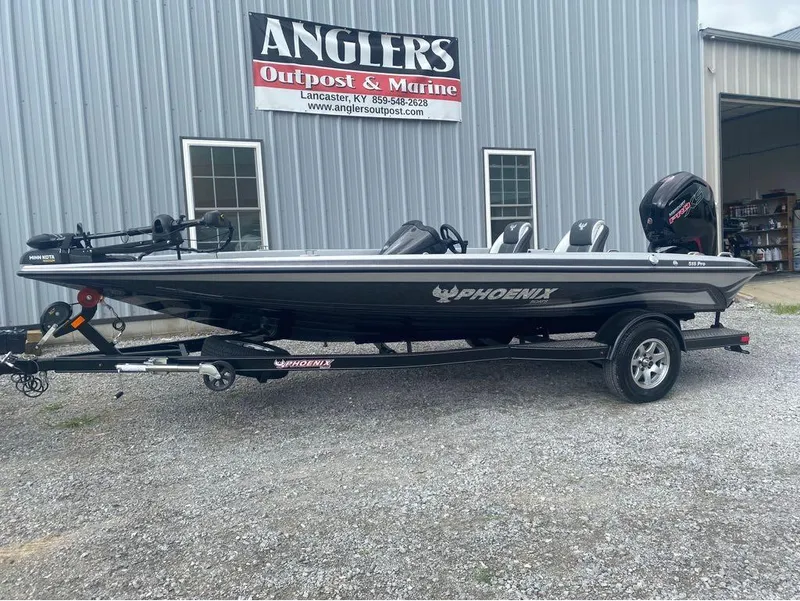 Slide: The Image of 2025 Phoenix 518 Pro boat on trailer outside Anglers Outpost & Marine. - 7
