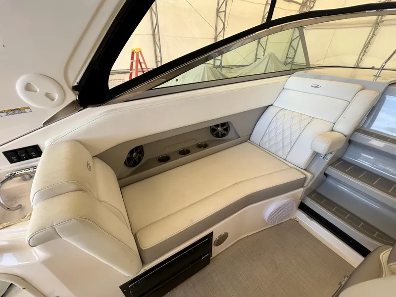 Slide: The Image of 2021 Regal 2800 Express boat interior with white leather seating and modern design. - 10
