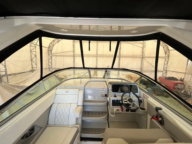 Slide: The Image of 2021 Regal 2800 Express boat interior with modern helm and seating. - 12