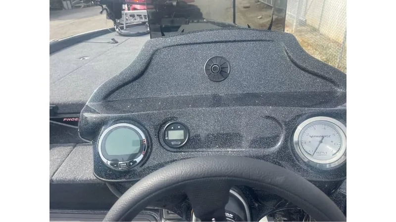 Slide: The Image of Dashboard of 2025 Phoenix 920 Elite boat with steering wheel and gauges. - 4