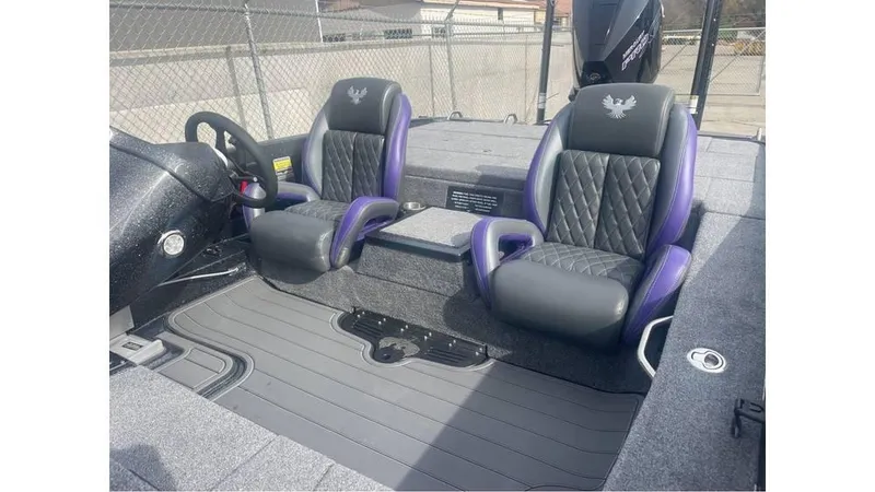 Slide: The Image of 2025 Phoenix 920 Elite boat interior with dual black and purple seats, diamond stitching. - 5
