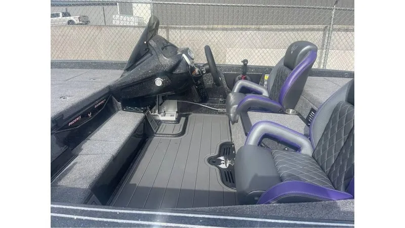 Slide: The Image of Interior of 2025 Phoenix 920 Elite boat with black and purple seating. - 6