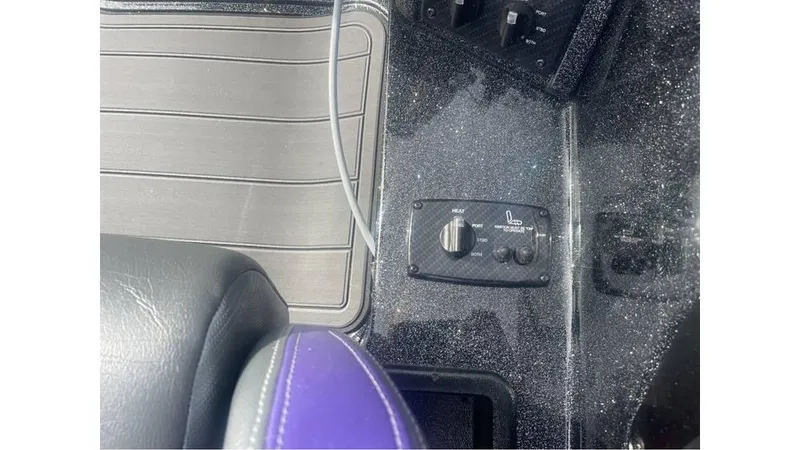Slide: The Image of Control panel in a 2025 Phoenix 920 Elite boat interior. - 8