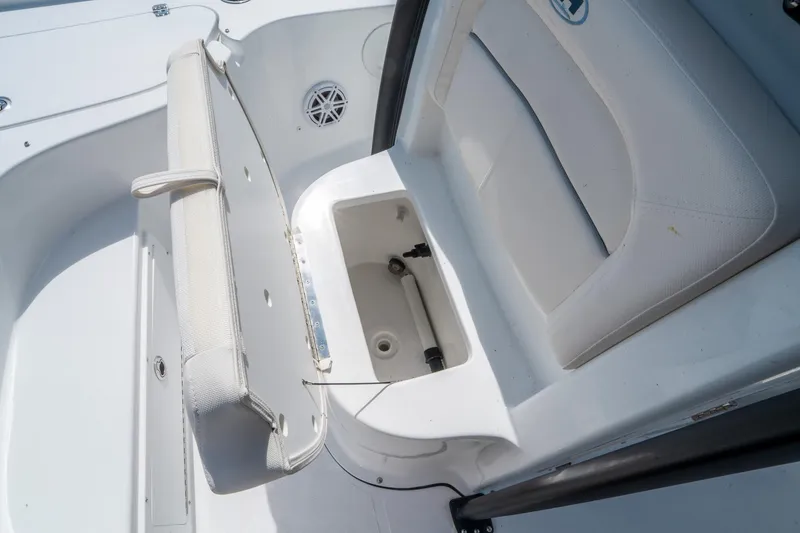 Slide: The Image of 2025 Sea Hunt BX 22 BR boat interior with open storage compartment and seating. - 22