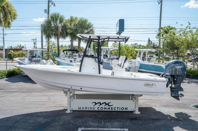 Slide: The Image of 2025 Sea Hunt BX 22 BR boat displayed at Marine Connection dealership. - 5
