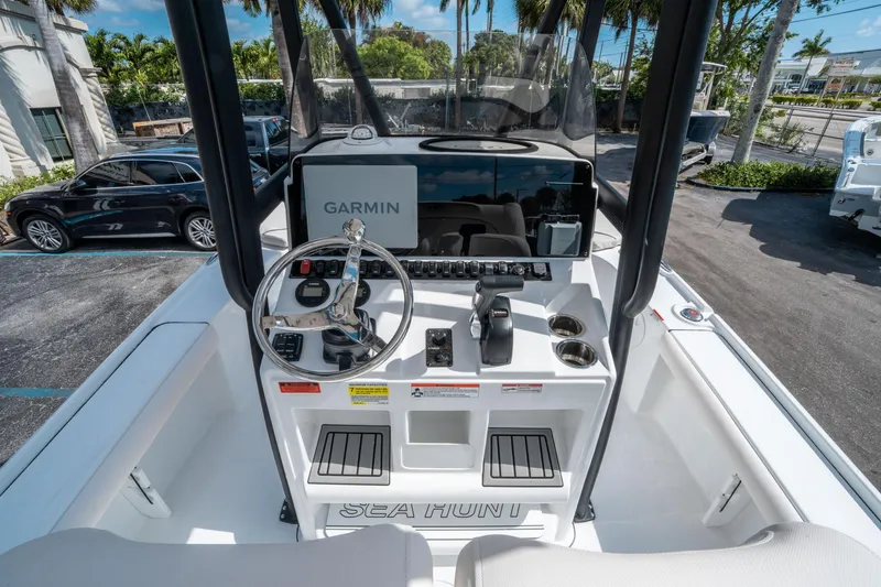 Slide: The Image of 2025 Sea Hunt BX 22 BR boat console with Garmin navigation system and steering wheel. - 15