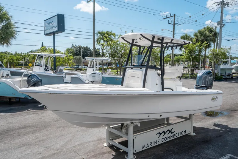 Slide: The Image of 2025 Sea Hunt BX 22 BR boat displayed at Marine Connection dealership. - 6